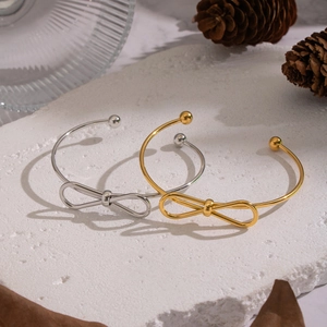 Minimalist stainless steel bow open cuff bracelets in polished gold and silver finishes