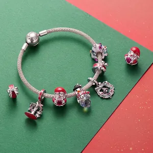 925 silver Christmas charm bracelet featuring Santa, snowman and wreath pendants