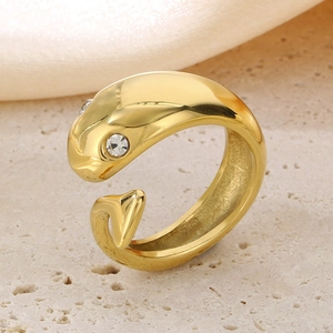 Detailed view of 18k gold plated snake-shaped ring with sparkling diamond eye detail