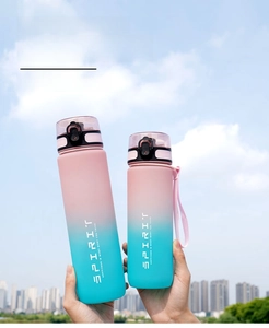 Detail of 1L and 750ml gradient sports water bottles with lock lids and carry straps