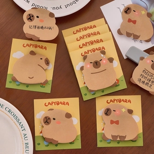 Set of cute cartoon Capybara sticky notes in various shapes on a wooden desk