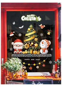 Festive Christmas window stickers with Santa Claus and Snowman on a store glass pane