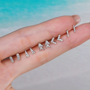 Silver geometric stainless steel stud earring set with pave zircon on finger display