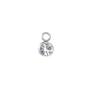 Macro detail of a 6mm round cubic zirconia pendant with silver claw setting for DIY jewelry