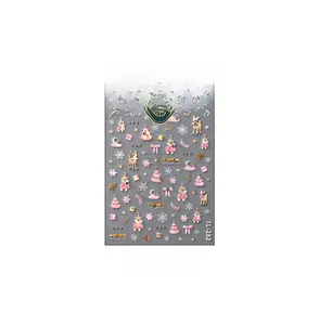 Detail of TL-282 Christmas nail stickers featuring pink cats and gold embossed snowflakes