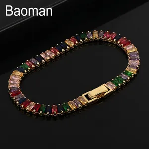 Detailed macro view of gold plated tennis bracelet with multicolor rectangle cut gemstones
