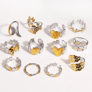 Adjustable two-tone gold and silver rings featuring mixed leaf and floral motifs