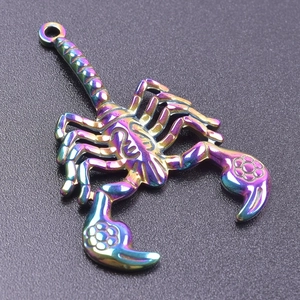 Close-up of rainbow gradient stainless steel scorpion pendant with intricate texture