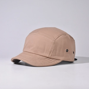 Detail view of khaki 5-panel camping hat with short brim and metallic eyelets