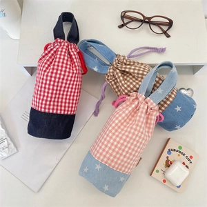 Plaid cotton and denim drawstring water bottle bag with star pattern and carry handle