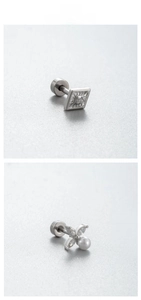 Detailed close-up of zircon earrings featuring flower and geometric star designs