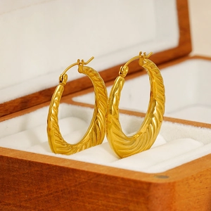 Fashionable gold-plated stainless steel hoop earrings with spiral twist texture in a gift box