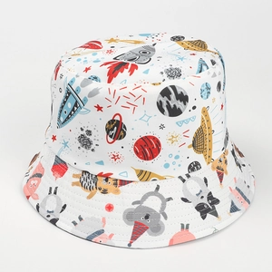Close-up of reversible bucket hat featuring cute cartoon animals and space exploration print