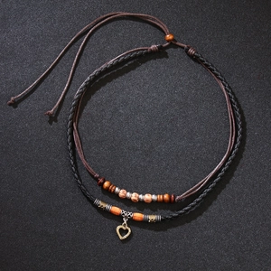 Vintage layered necklace with wood beads, leather cord and metallic heart love pendant