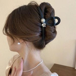 Large matte black square hair claw with pearl and heart rhinestone on brunette hair