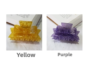 Close-up of acetic acid bow hair claw clips with rhinestones in yellow and purple