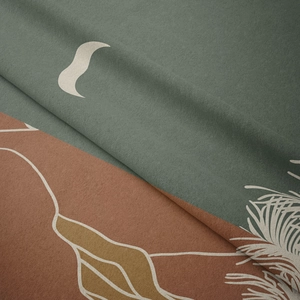 Detailed close-up showing soft textured fabric with abstract moon and mountain pattern