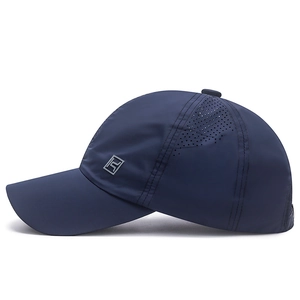 Deep blue quick-dry sports baseball cap with laser-cut ventilation and silver logo
