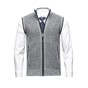 Detailed view of gray knit vest featuring smooth zipper closure and classic stand collar