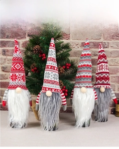 Set of four knitted Christmas gnome wine bottle covers with plush beards for holiday decor