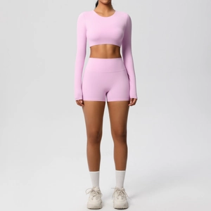 Close-up of lavender seamless yoga set with long sleeve crop top and high waist shorts