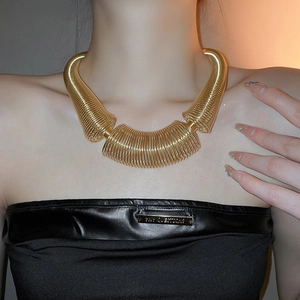 Exaggerated golden metal spring choker necklace for women featuring bold spiral coil design