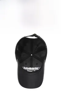 Detail view of cotton baseball cap interior featuring embroidery and metal buckle
