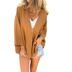 Women's loose brown V-neck cardigan featuring long sleeves and single-button closure