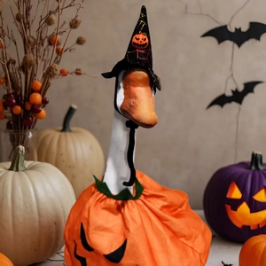 Halloween goose outfit with orange pumpkin body suit and black wizard hat decor