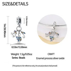 Detailed dimensions of the guitar pendant showing height and width in inches and millimeters