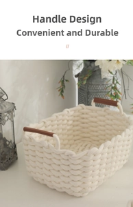 Detail of woven cotton storage basket showing reinforced brown leather handles for easy grip