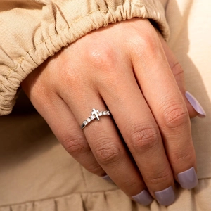Elegant S925 sterling silver cross ring with sparkling cubic zirconia on female hand