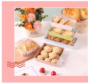 Close-up of assorted colorful pastry boxes with clear lids showcasing fresh desserts