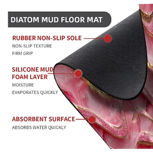 Detail of pink marble diatom mud mat showing non-slip rubber base and multi-layer fabric