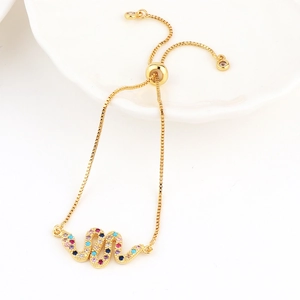 Adjustable gold snake bracelet featuring colorful cubic zirconia and sliding box chain