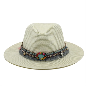 Detail of bohemian fedora hat featuring turquoise stone, colorful beads and gray tassels