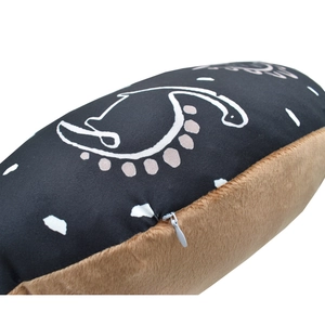 Close-up of nursing pillow cover featuring printed fabric and soft plush with hidden zipper