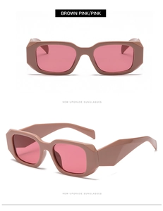 Detail of pink lenses and brown geometric faceted frame on rectangle sunglasses