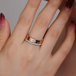Close-up of elegant titanium steel ring set with a round zircon and pave-set diamond band