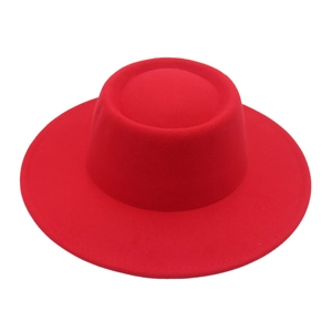 Detailed close-up of a red flat top felt hat with wide brim and reinforced stitching