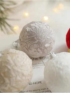 Close-up of 8cm Christmas foam ball featuring elegant lace patterns and fabric textures