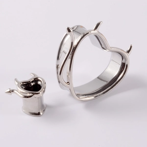 Polished silver heart devil horn ear tunnels in two different sizes for body piercing