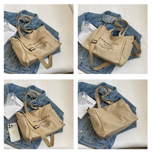 Khaki large capacity canvas tote bag with adjustable shoulder strap and print