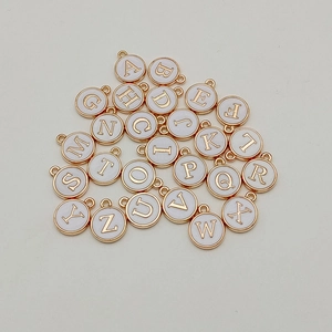 26 round gold-plated alphabet charms with white enamel for DIY necklaces and bracelets