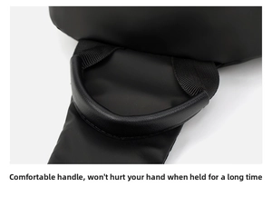 Macro detail of the reinforced ergonomic handle and nylon strap on a black men's chest bag
