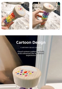 Detail of wooden rainmaker toy showing colorful beads and rainbow pattern on the end cap