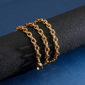 Detailed view of classic golden stainless steel O-chain link necklace with lobster clasp
