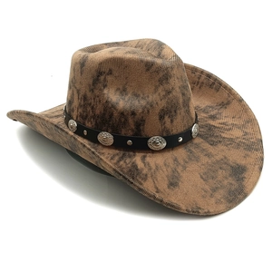 Detail of vintage brown cowboy hat with leather band and silver concho ornaments