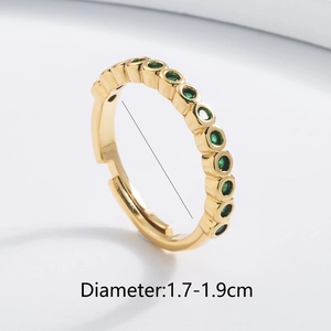 Close-up of 18K gold plated ring with green zircon and diameter sizing info