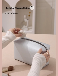 Silver PU leather cosmetic bag with cross pattern texture and portable metal zipper